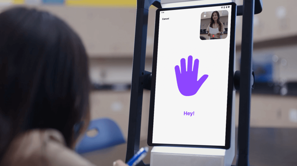 An image of a student giving a high-five to a M2 device, demonstrating a new interactive greeting to start a reflection.