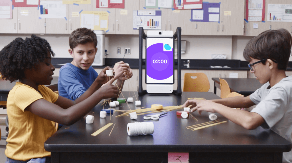 students making spagetti tower, with help of M2 device