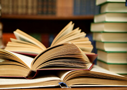 A lot of books on the table